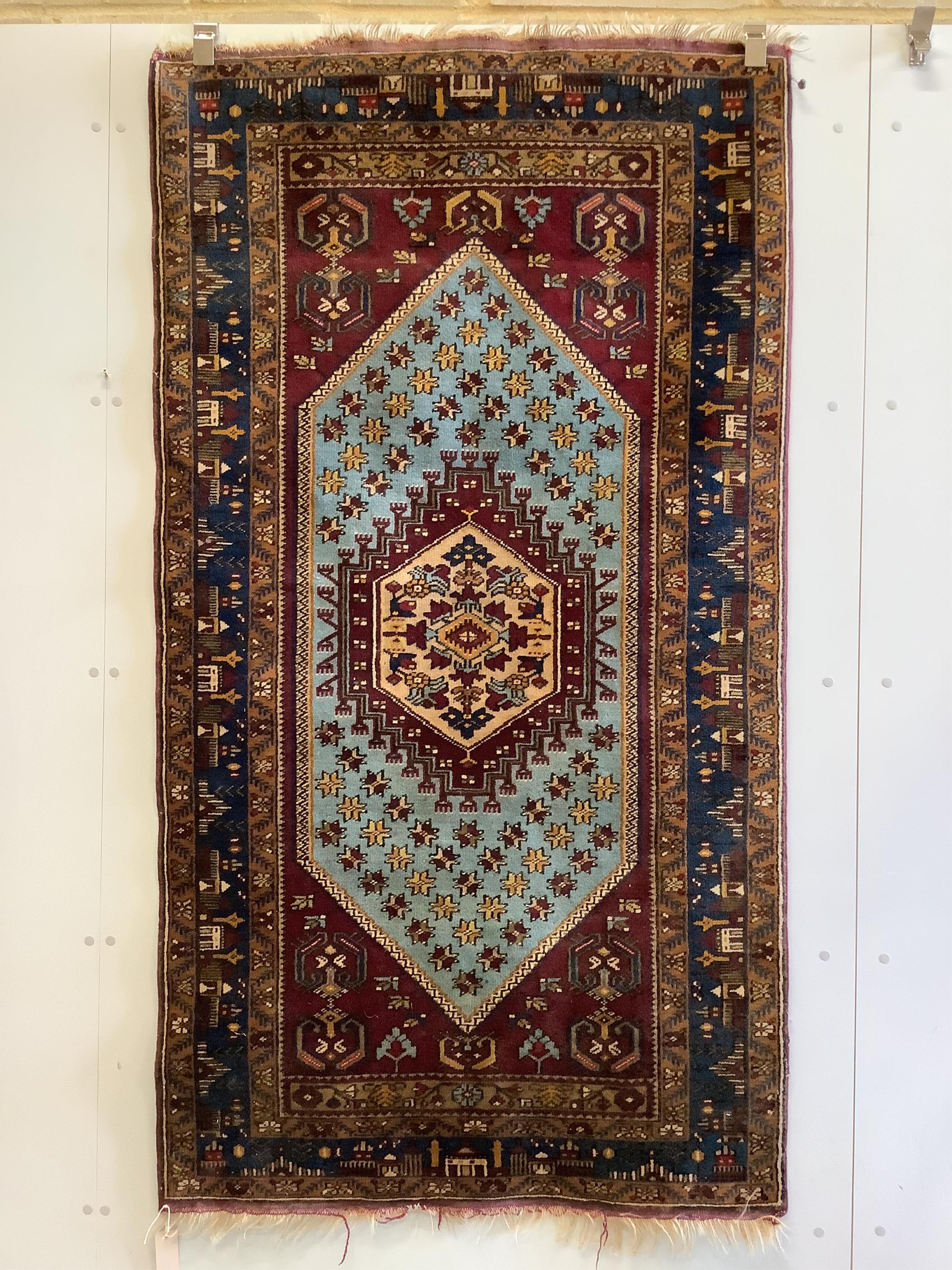 A North West Persian rug, 182 x 101cm. Condition - fair